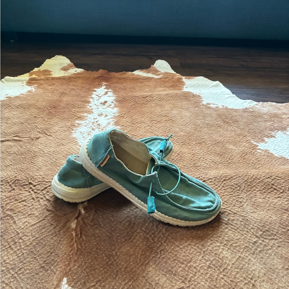 Women's Hey Dudes slip on shoes 
size 7
Some wear no holes